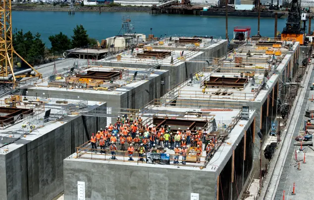 Large Marine construction with crew on roof