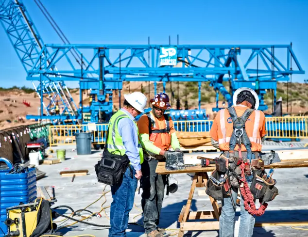 Superintendent checking on employee workers