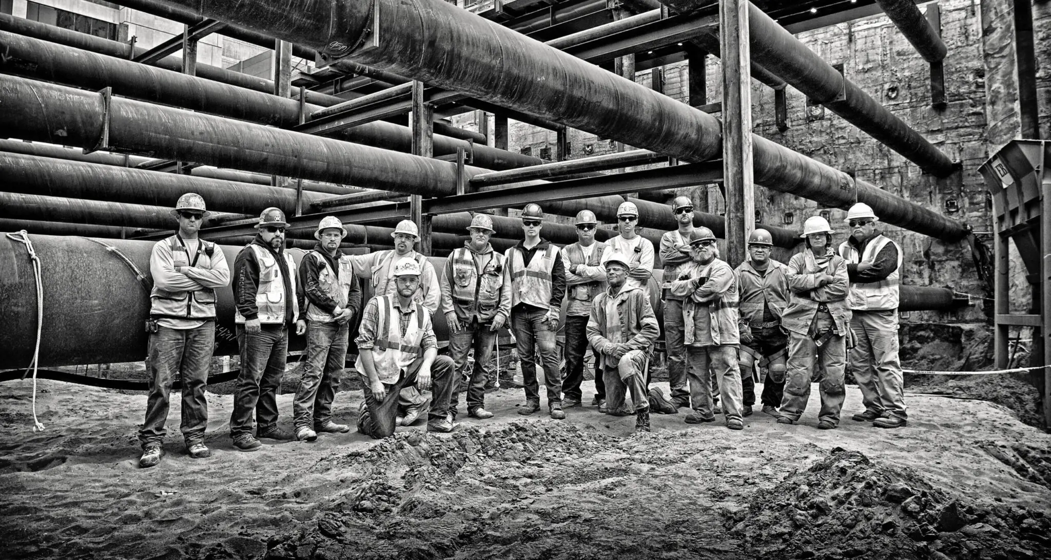 Black and white image of group of construction workers